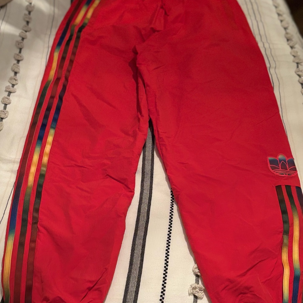 Adidas Red trackpants with Iconic Stripes